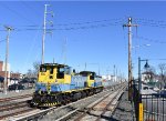 The two MP15AC locomotives heading away from Mineola Station 